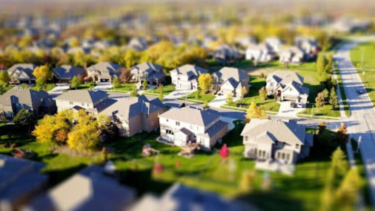 A suburban neighborhood with tree-lined streets and modern houses showing the lifestyle shaped by generations on the move.
